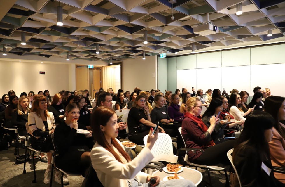 A full room listening to a talk