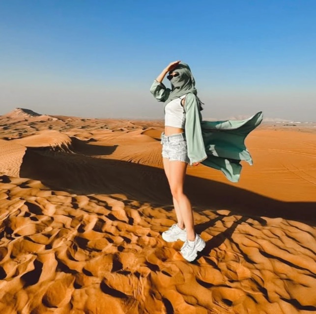Standing on a sand dune in the desert